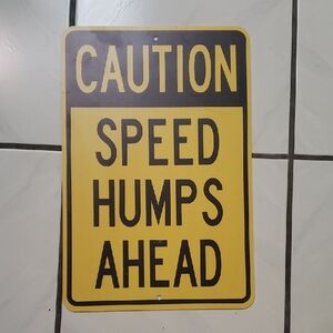 Brand new "Yellow Caution Speed Humps" metal sign